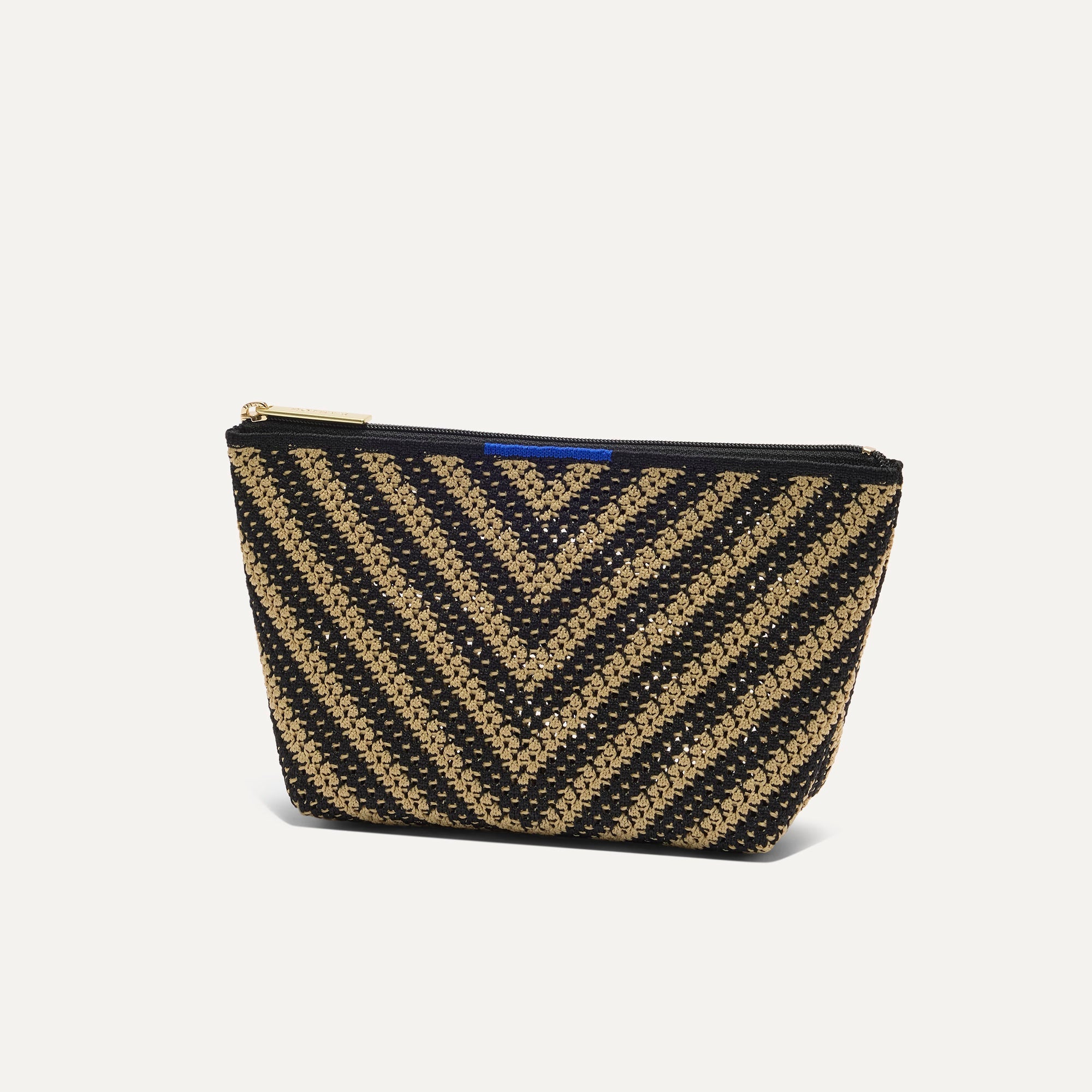 The Small Travel Pouch Set in Toffee Chevron shown from the side.