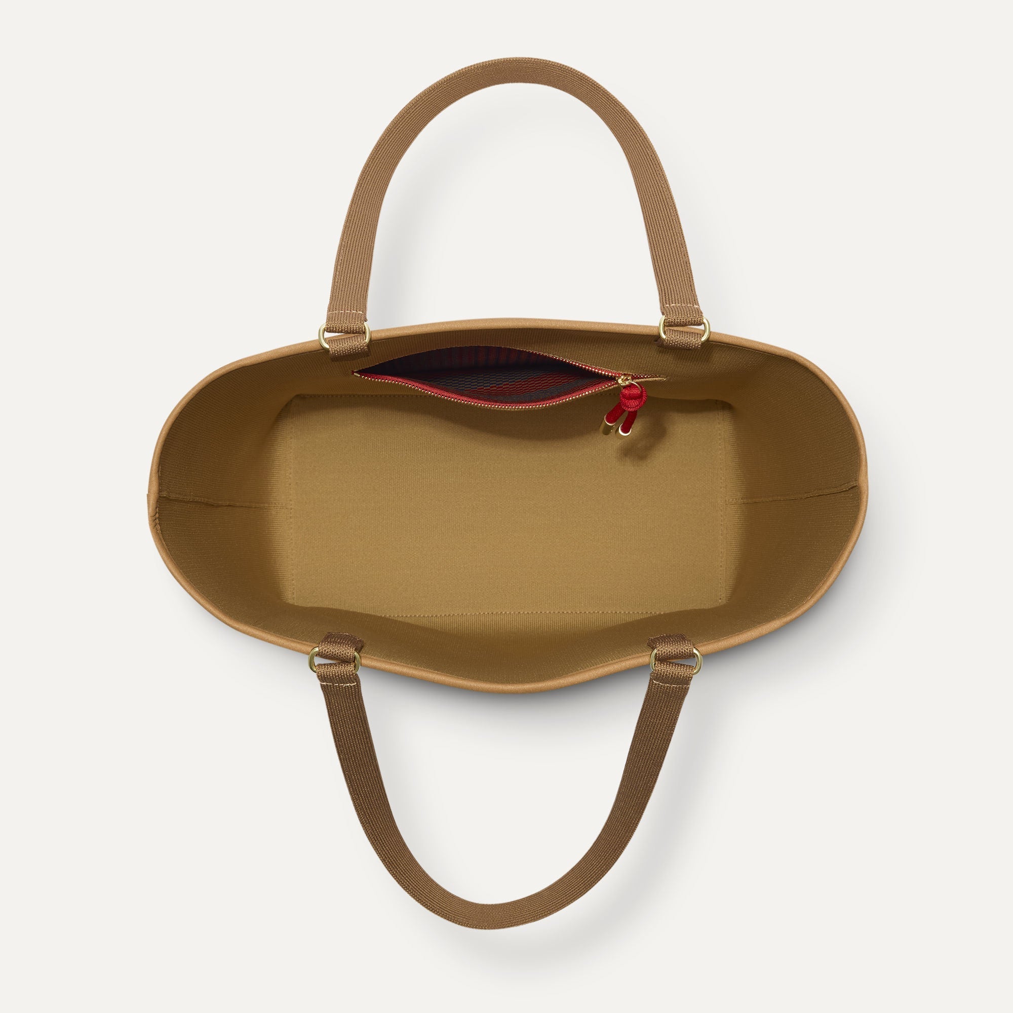The Two-Way Tote in Sienna, shown from above, with the reversible interior exposed.