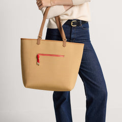 hover | Model carrying The Two-Way Tote in Sienna.