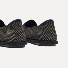 Close up of the heel of The Cruiser Loafer in ReVelvet Jet Herringbone, with Rothy's signature blue halo. 