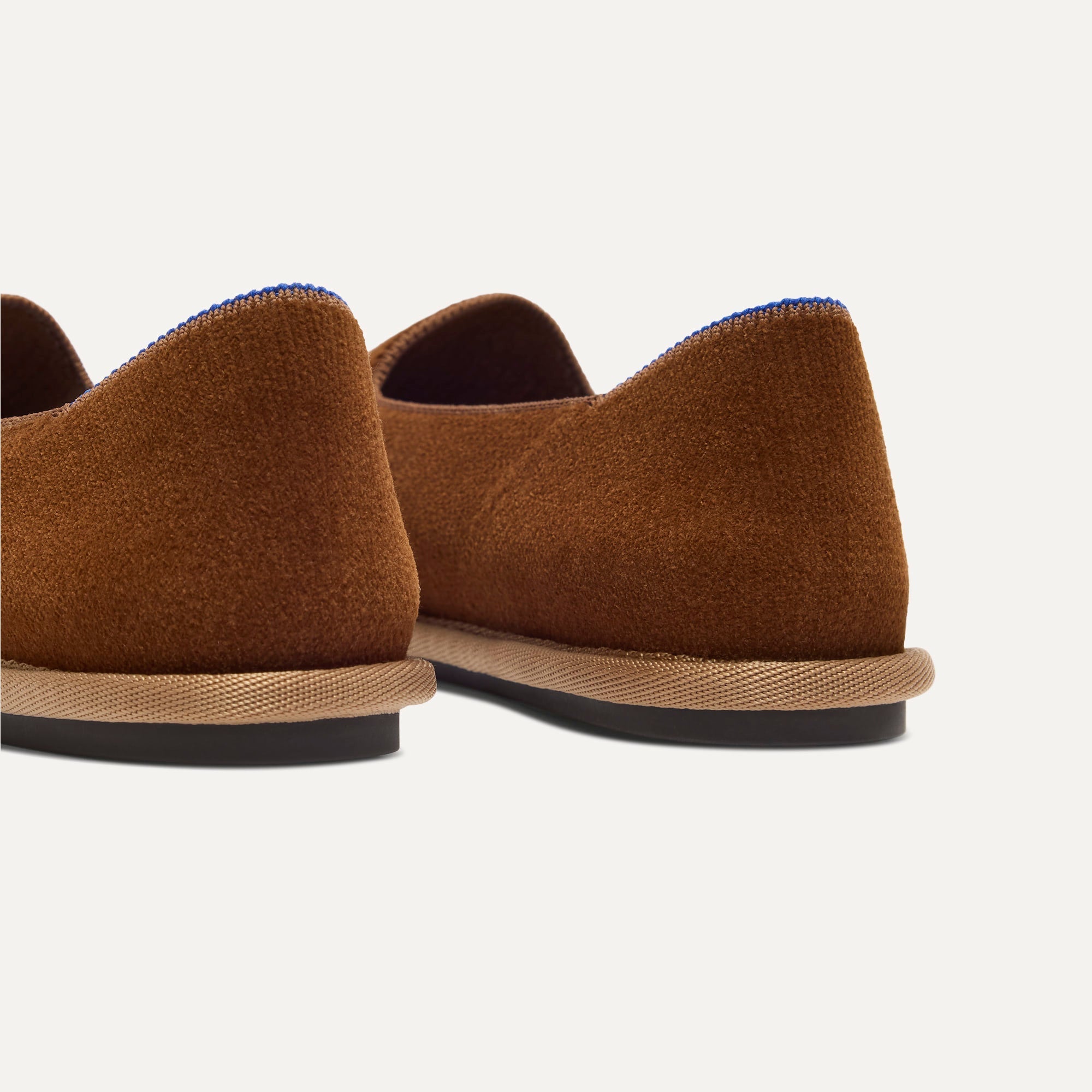 Close up of the heel of The Cruiser Loafer in ReVelvet Russet, with Rothy's signature blue halo. 