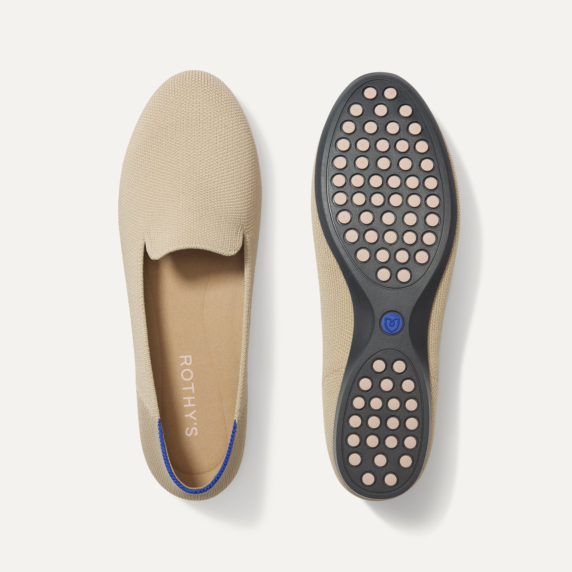PLP |The Daily Loafer in Ecru shown from the top with one shoe showing the outsole. 
