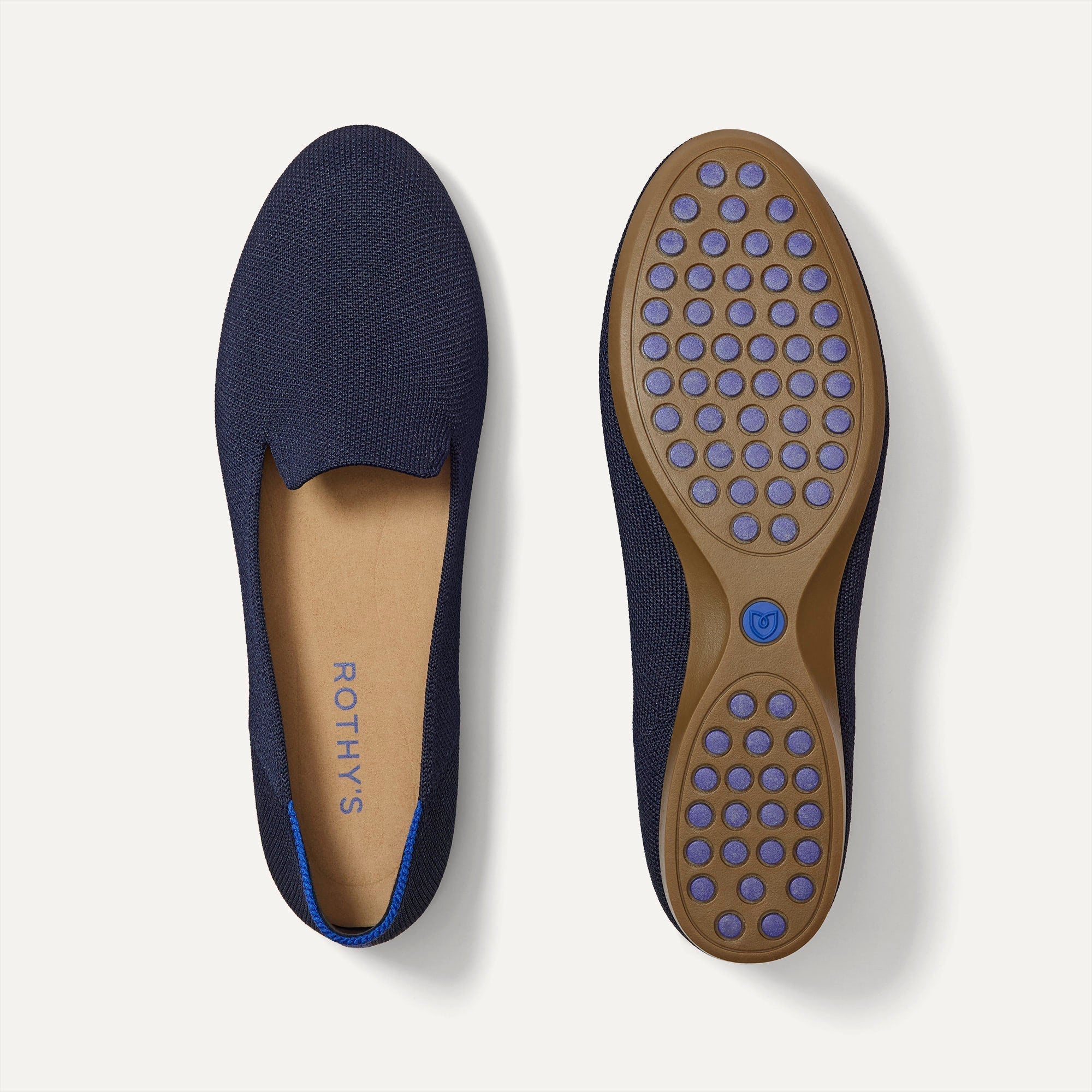 PLP | The Daily Loafer in Navy shown from the top with one shoe showing the outsole. 