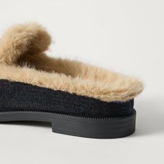 Close up of the heel of The Après Loafer Mule in ReVelvet Black.