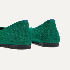 Close up of the heel of The Max Square Ballerina in Clover Mesh with Rothy's signature blue halo.
