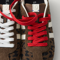 Overlay:: Extra pair of laces included—swap for a new look anytime. | Alt:: Close up of the top of The Ivy Sneaker in ReVelvet Cheetah, showing different lace choices.