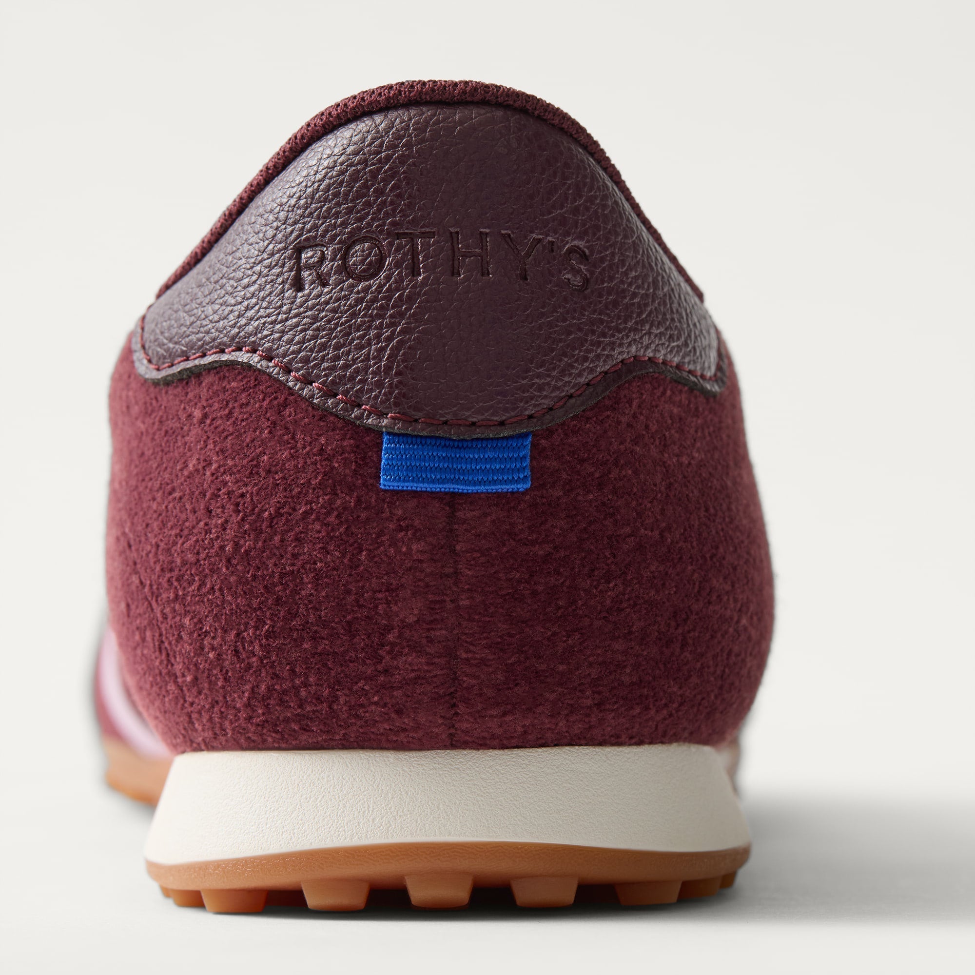 Close up of the heel of The Ivy Sneaker in ReVelvet Syrah.