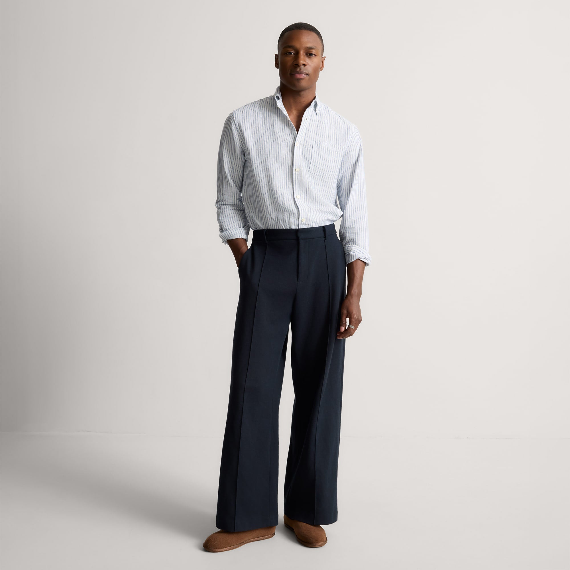 Alternate view of a model wearing The Men's Cruiser Loafer in ReVelvet™ Umber. 