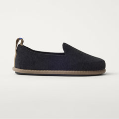 The Mini Loafer in ReVelvet™ Black shown from a side view showing the outsole.