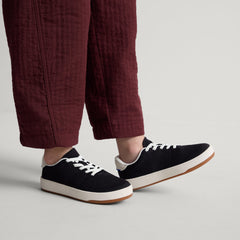 hover | A child modeling The Kids Stretch Sneaker in Zoom.