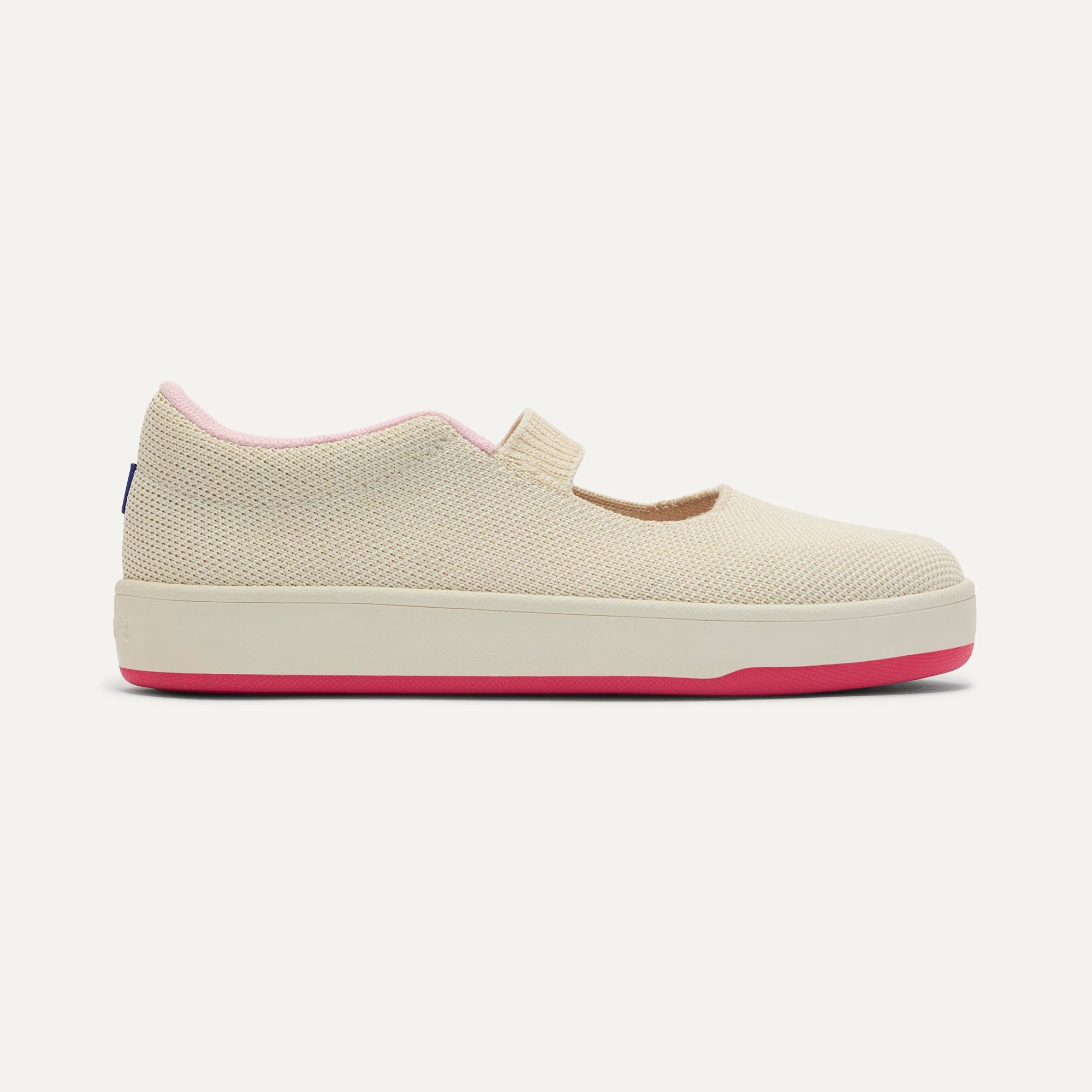 side | The Kids MJ Sneaker in Cream Puff shown from the side.