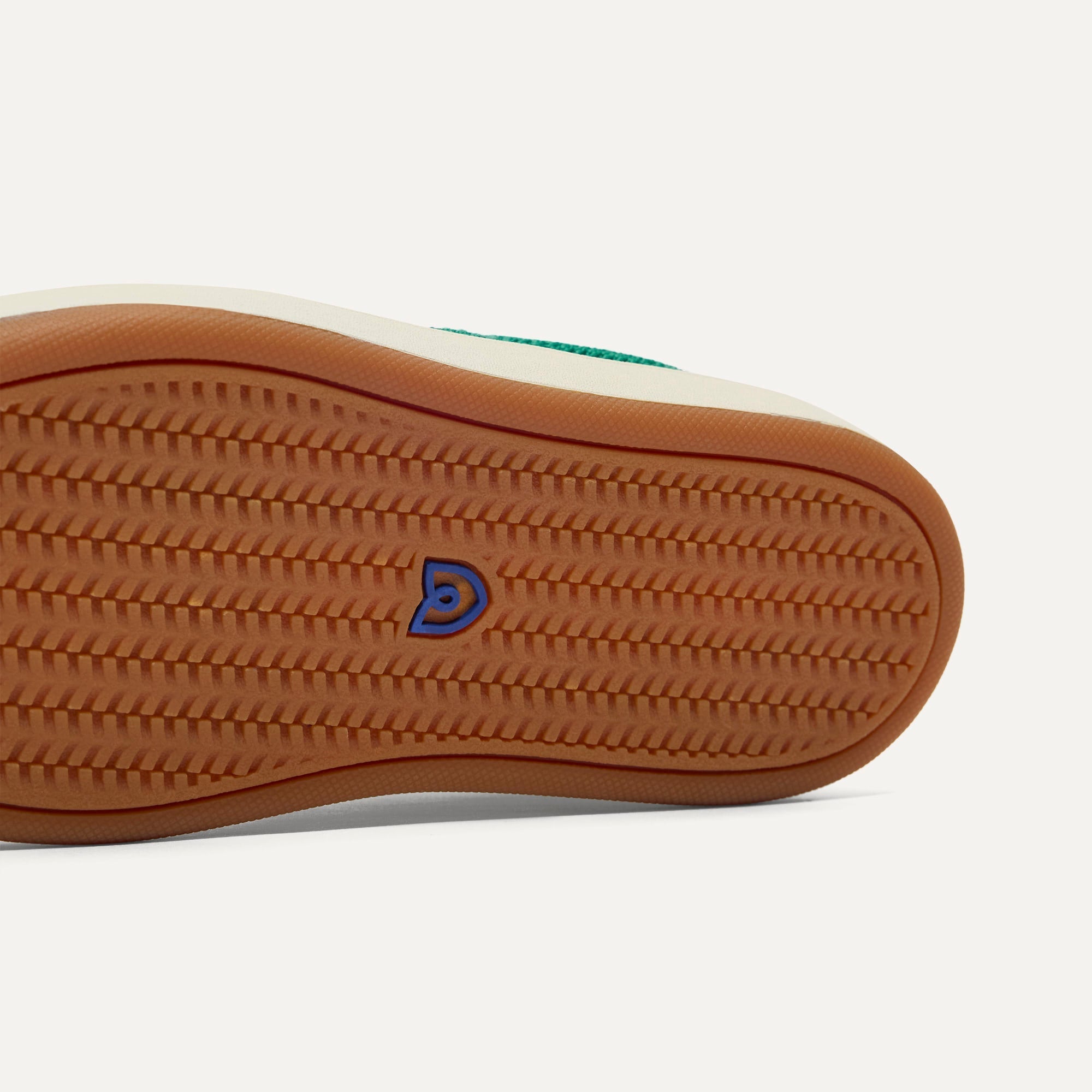 The sole of The Kids Stretch Sneaker in Emerald Pop.