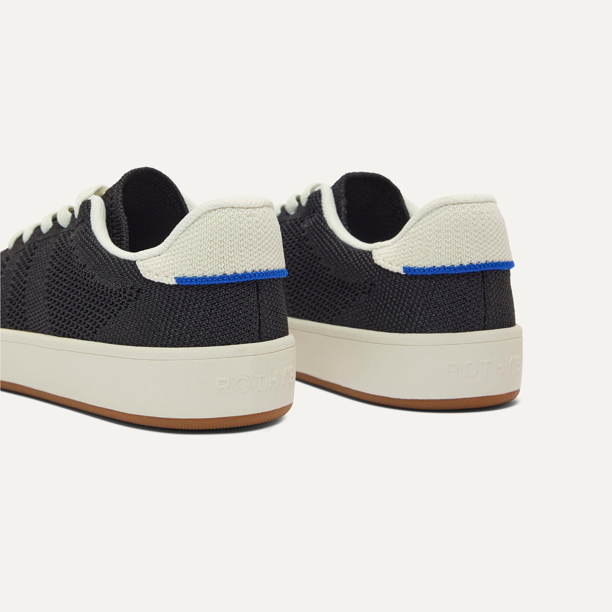 Close up of the heel of The Kids Stretch Sneaker in Zoom, with Rothy's signature blue halo. 