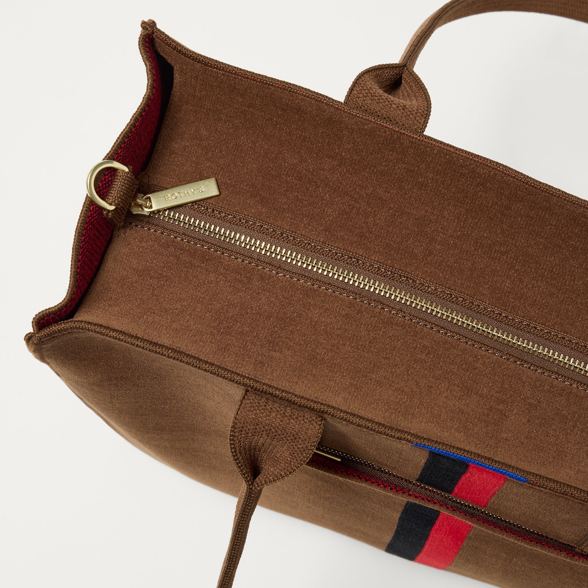 The Classic Tote in ReVelvet Cinnamon Stripe, shown from above, with the top zipper closed. 