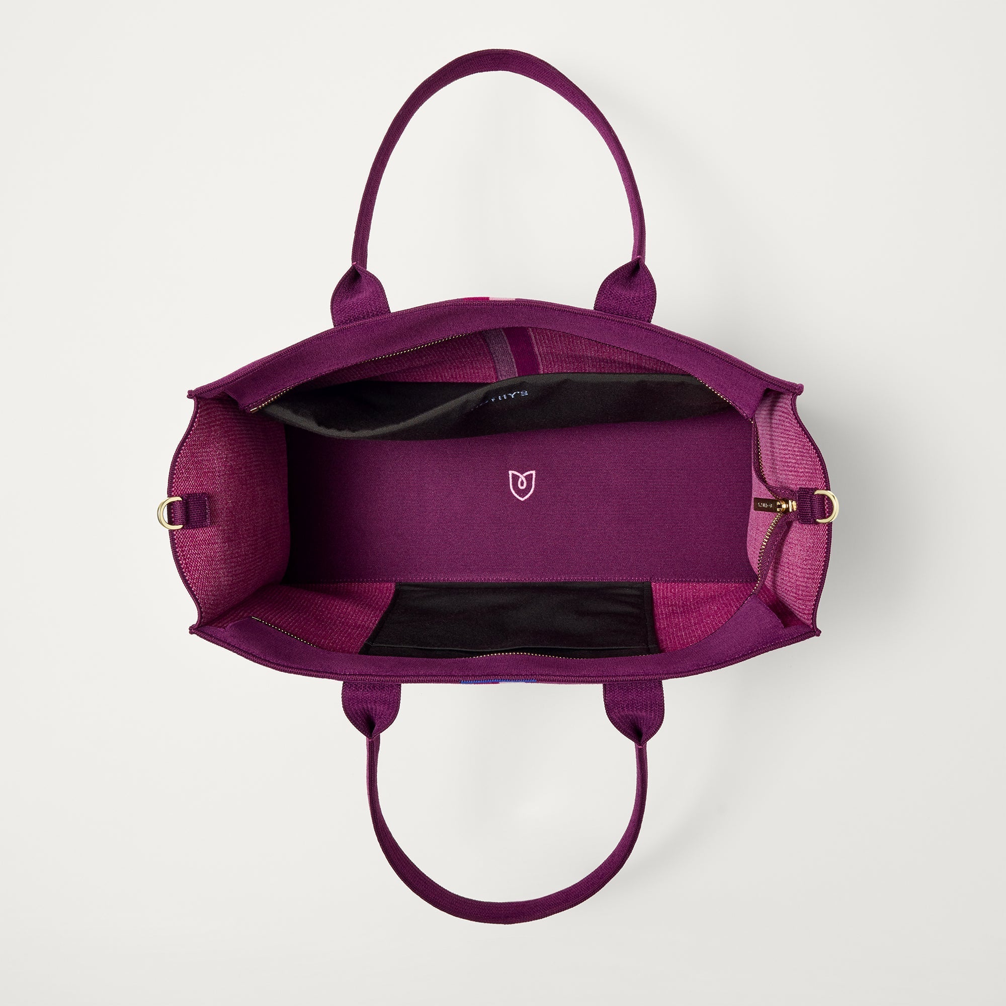 The Classic Tote in ReVelvet Orchid, shown from above, with the interior exposed.