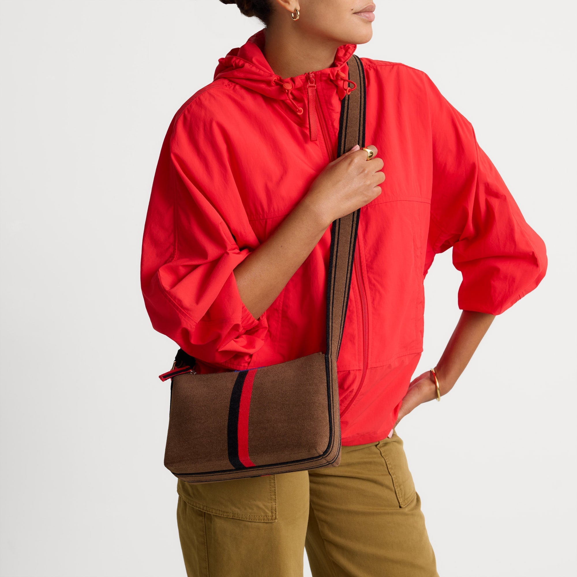 hover | Model wearing The Casual Crossbody in ReVelvet Cinnamon Stripe, shown from the front.