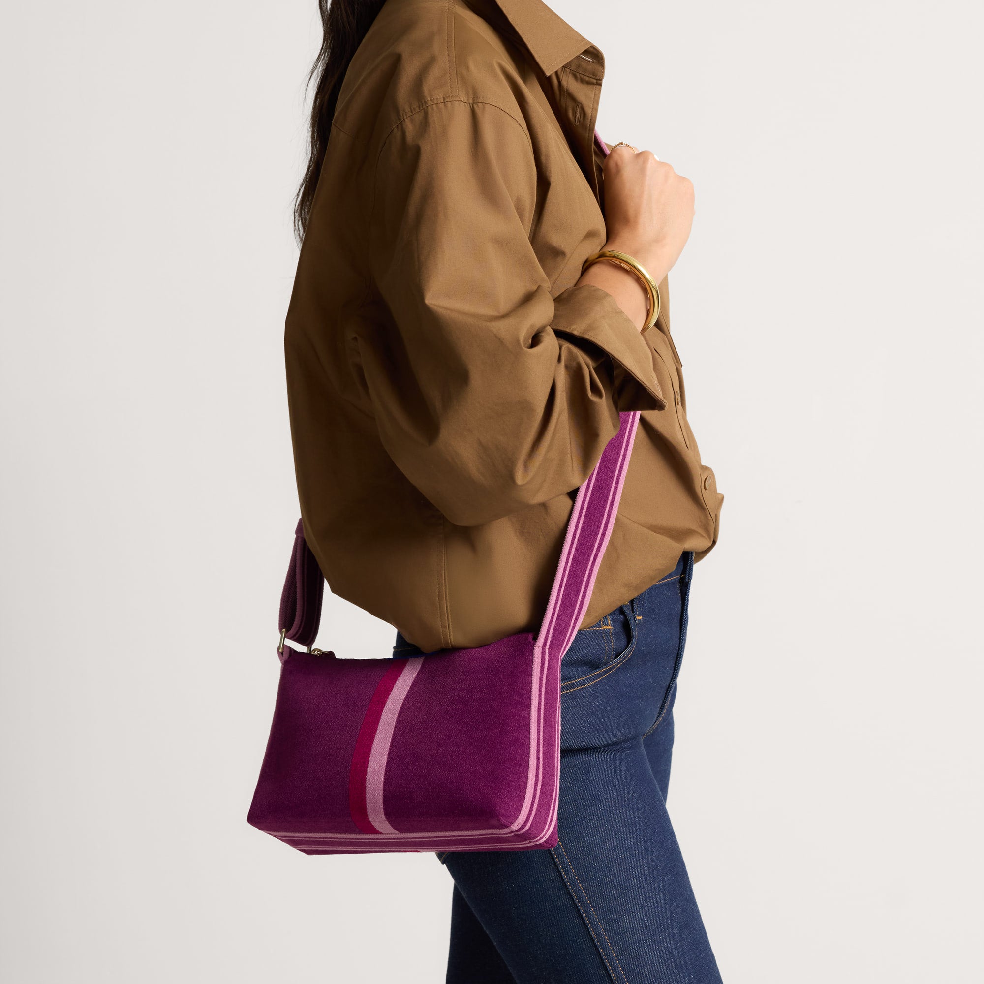 hover | Model wearing The Casual Crossbody in ReVelvet Orchid, shown from the front.