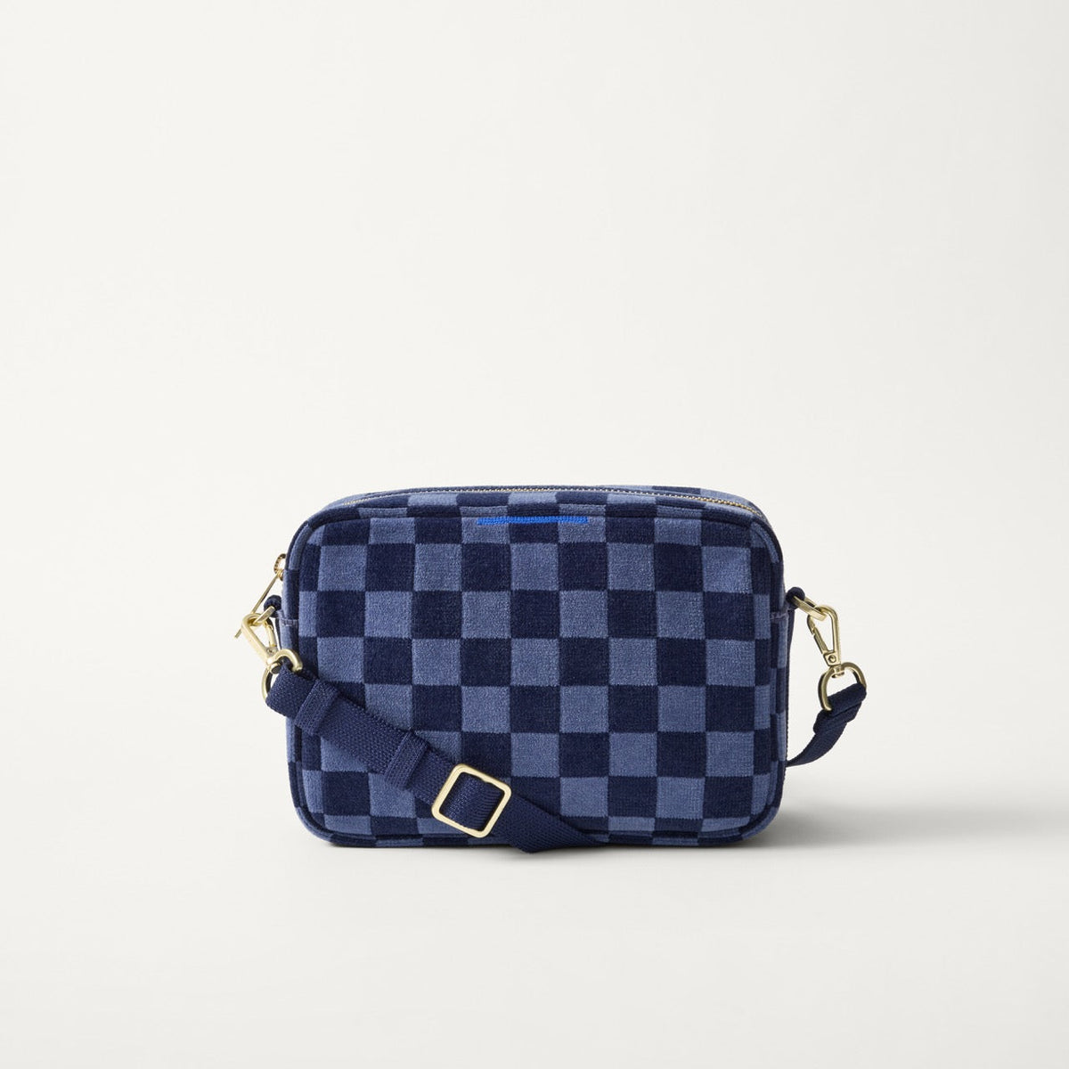 EXT | The Crossbody Camera Bag in  ReVelvet™ Blue Ink, shown from the front. 