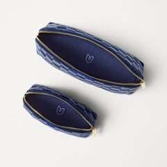 The Vanity Set in ReVelvet™ Blue Ink shown from the top with zipper closure open. 