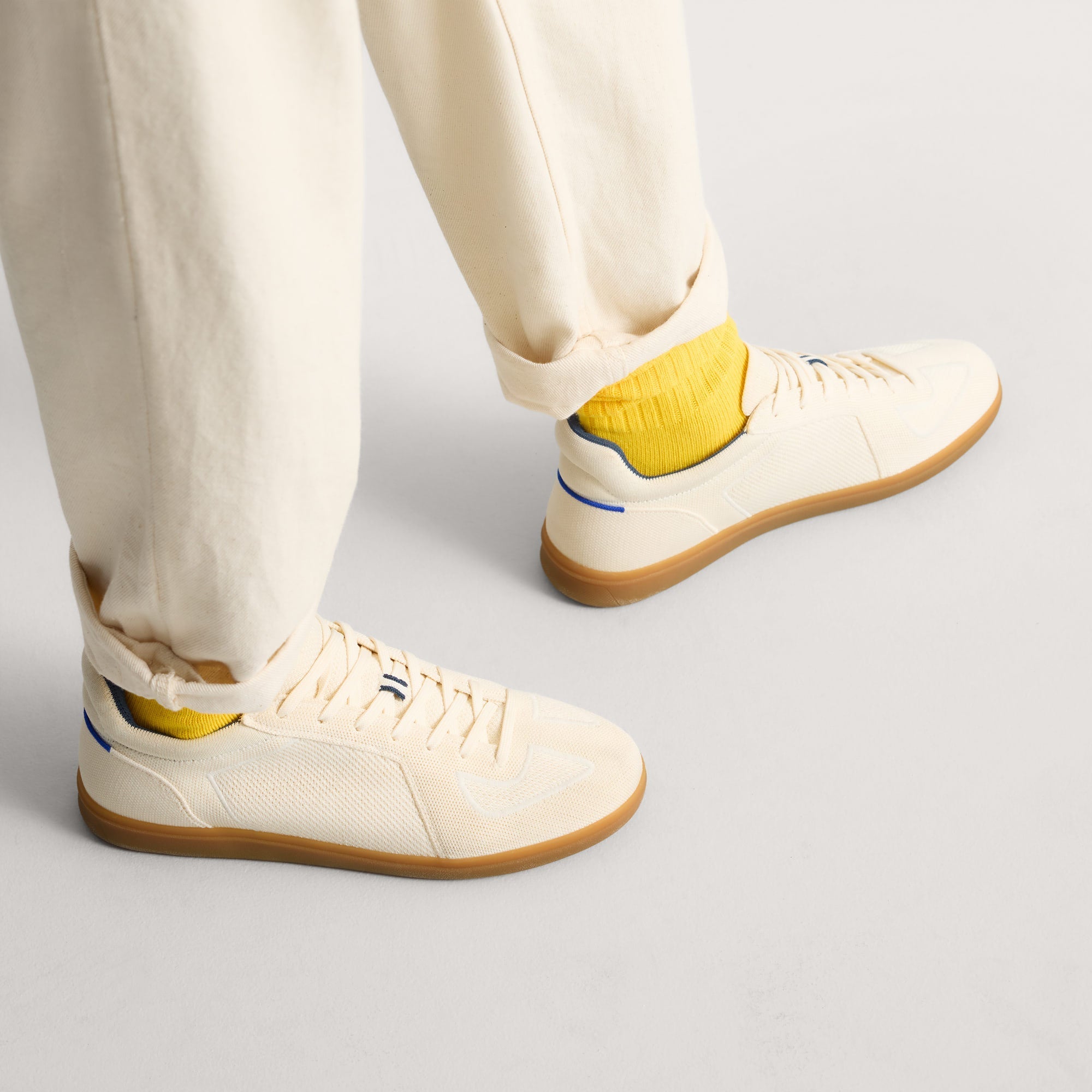 hover | Model wearing The RS01 Sneaker in Bone.