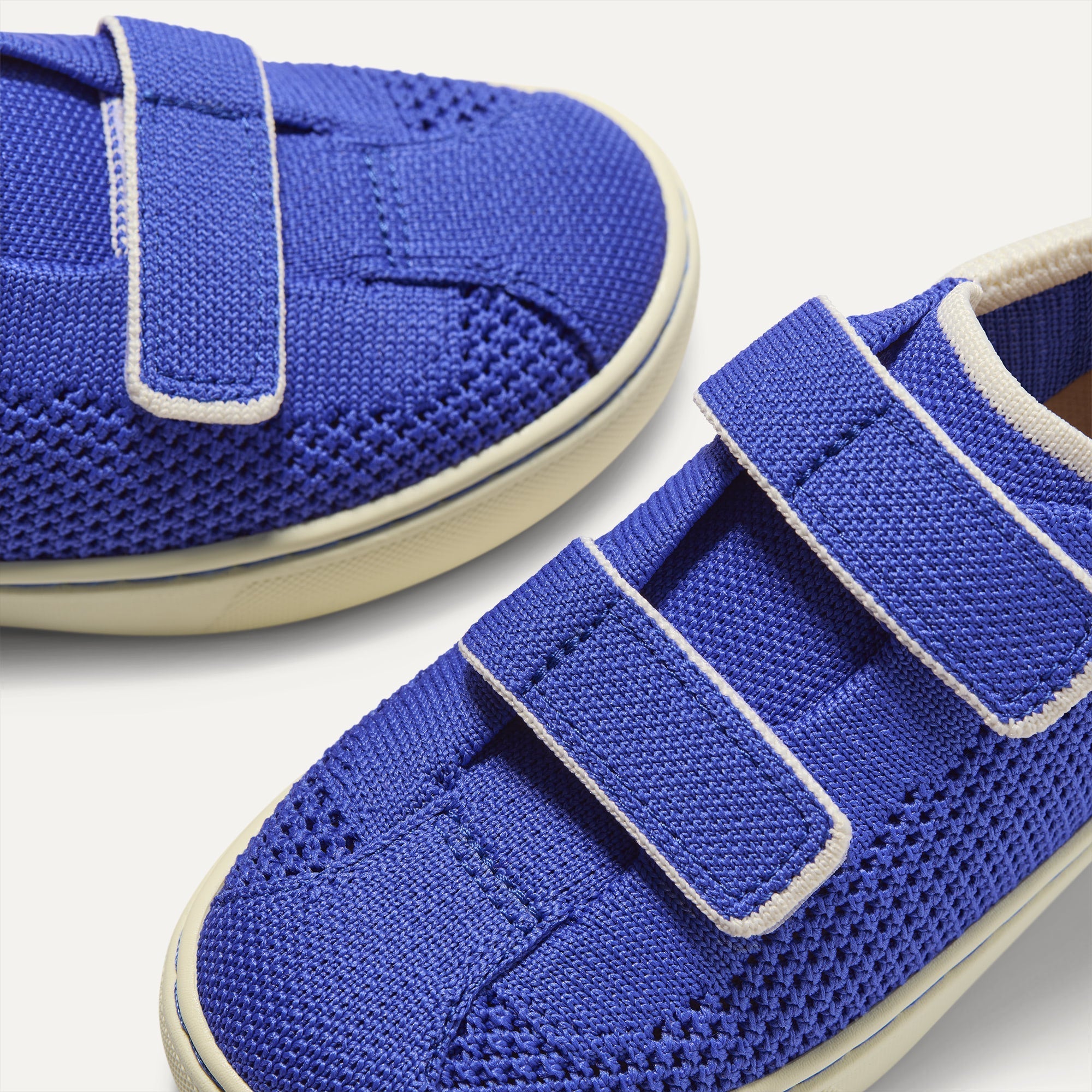 Close up of the vamp of The Kids Strap Sneaker in Buoy Open-Knit. 