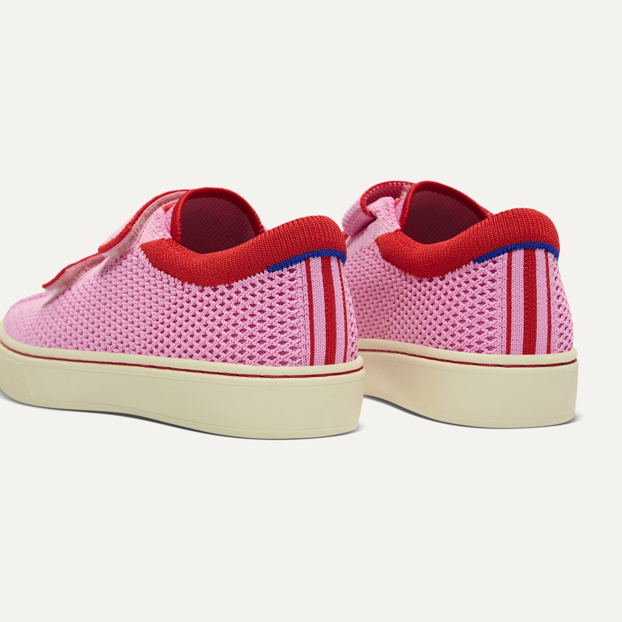 Close up of the heel of The Kids Strap Sneaker in Tutu Open-Knit, with Rothy's signature blue halo. 