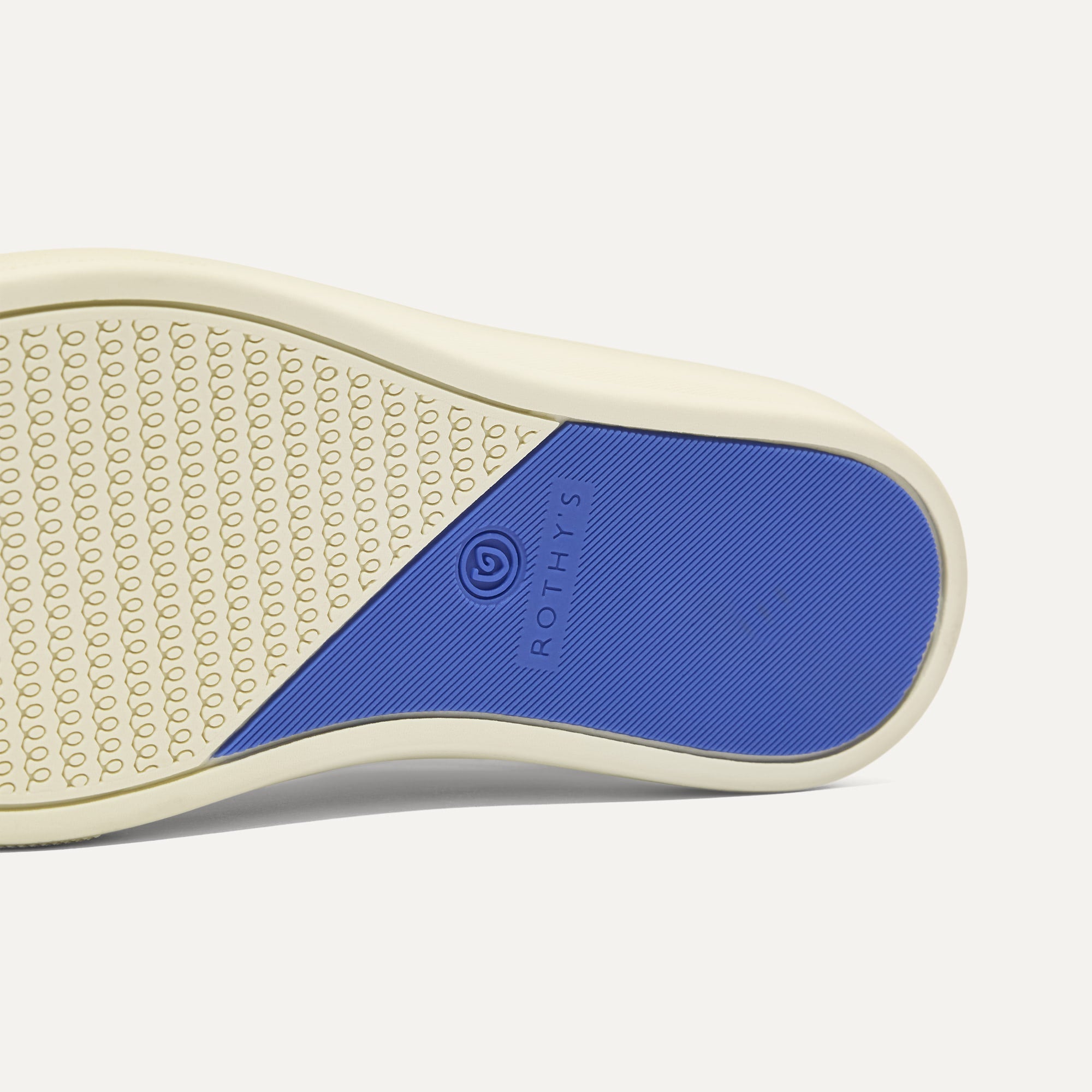 The sole of The Kids Strap Sneaker in Chess Open-Knit.