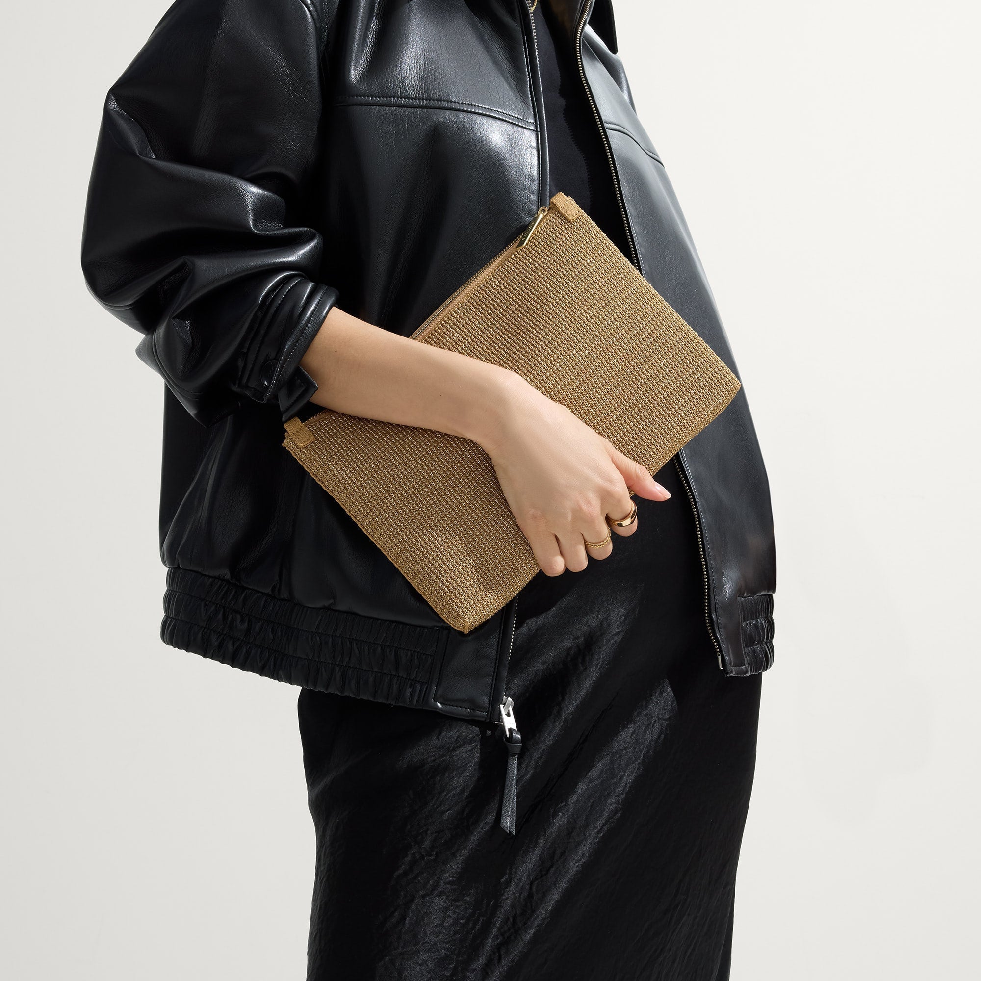 hover | Model shown holding the Convertible Clutch in Glitzy Gold.