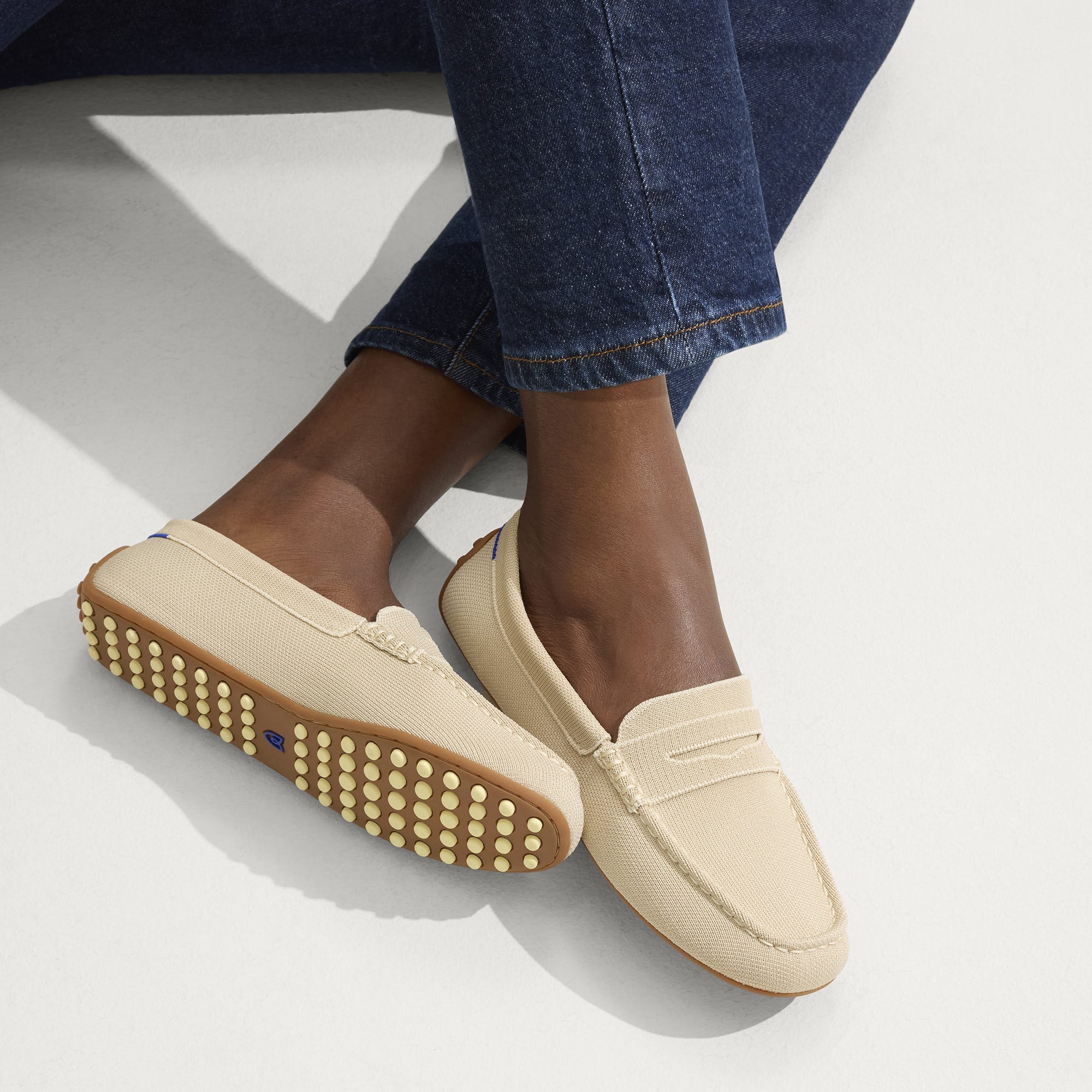 hover | Model wearing The Daily Driver in Sesame. 