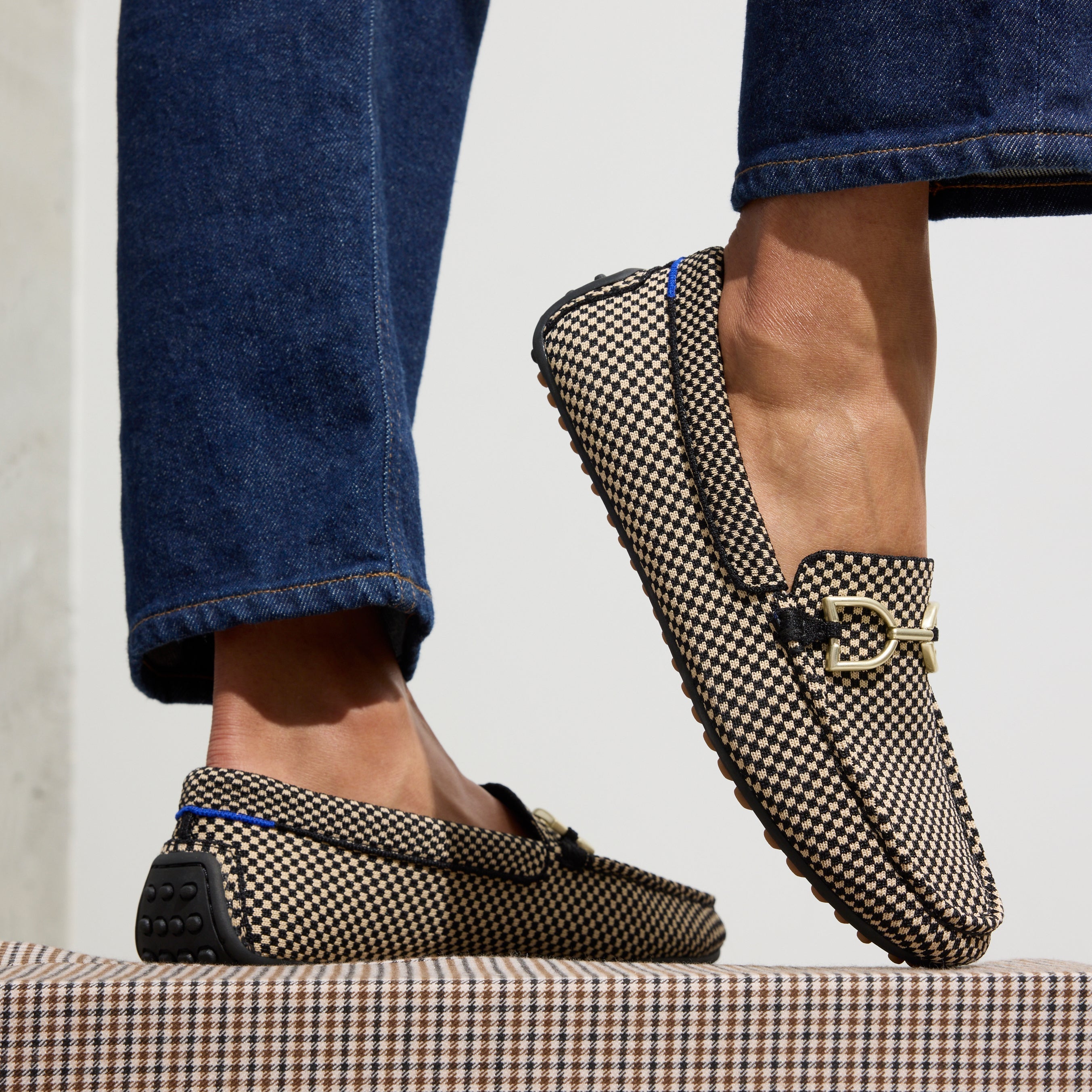 hover | Model wearing The Double Bit Driver in Classic Micro Check. 