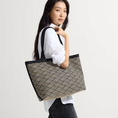 hover | Model shown holding The Lightweight Zip Tote in Polar Zig Zag.